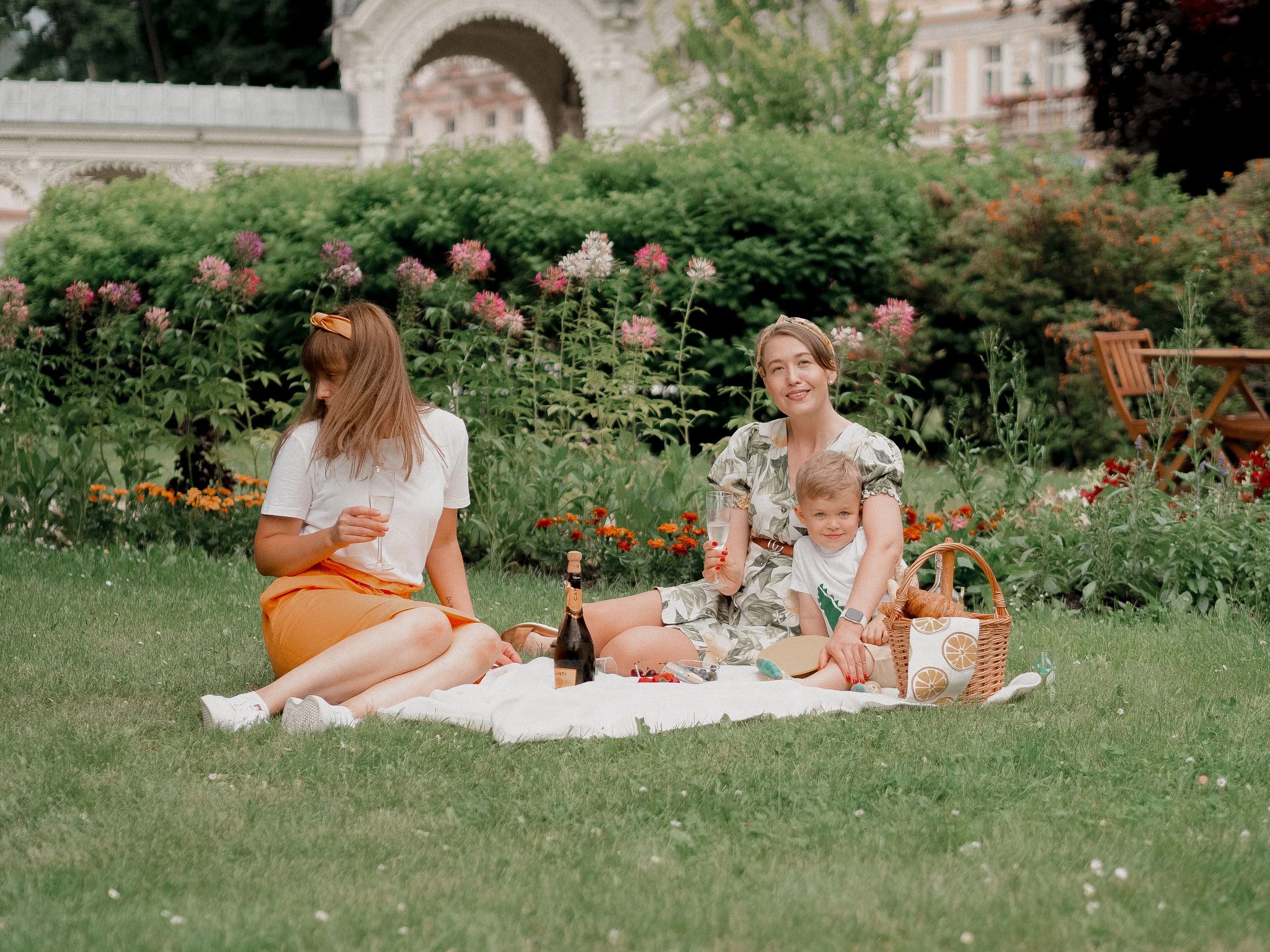 A family enjoying a picnic in a sunny garden