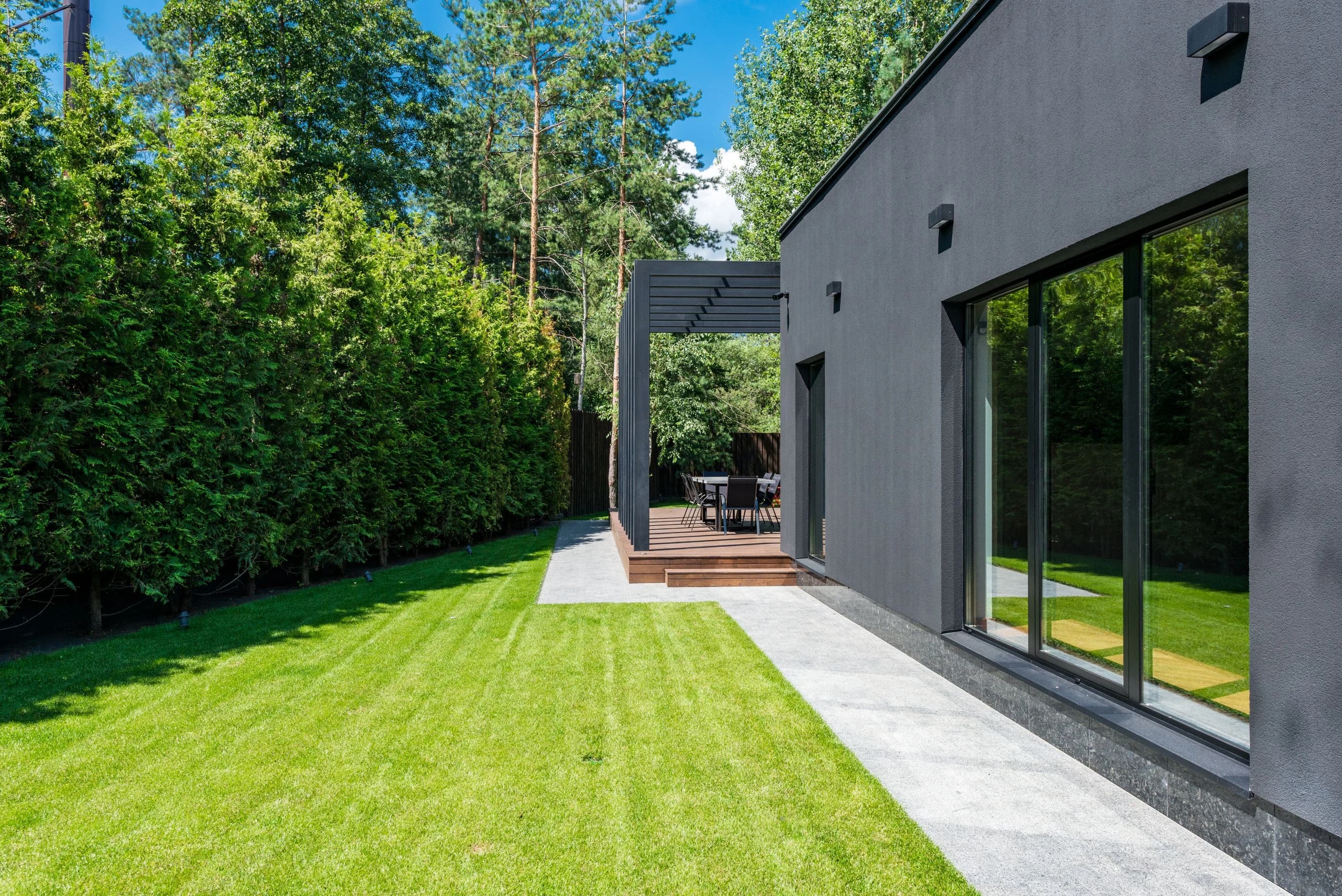 A modern home with a landscaped garden and outdoor seating